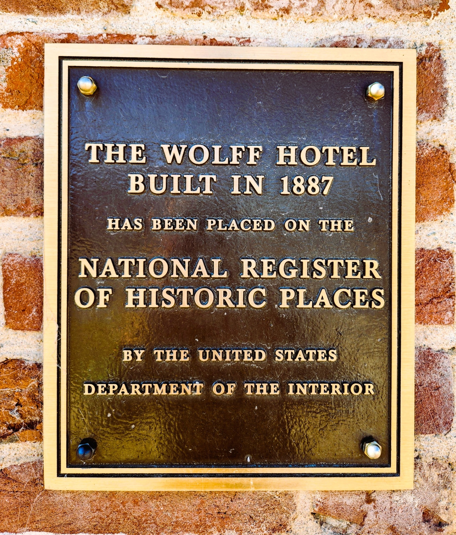 National Register of Historic Places plaque for The Wolff Hotel
