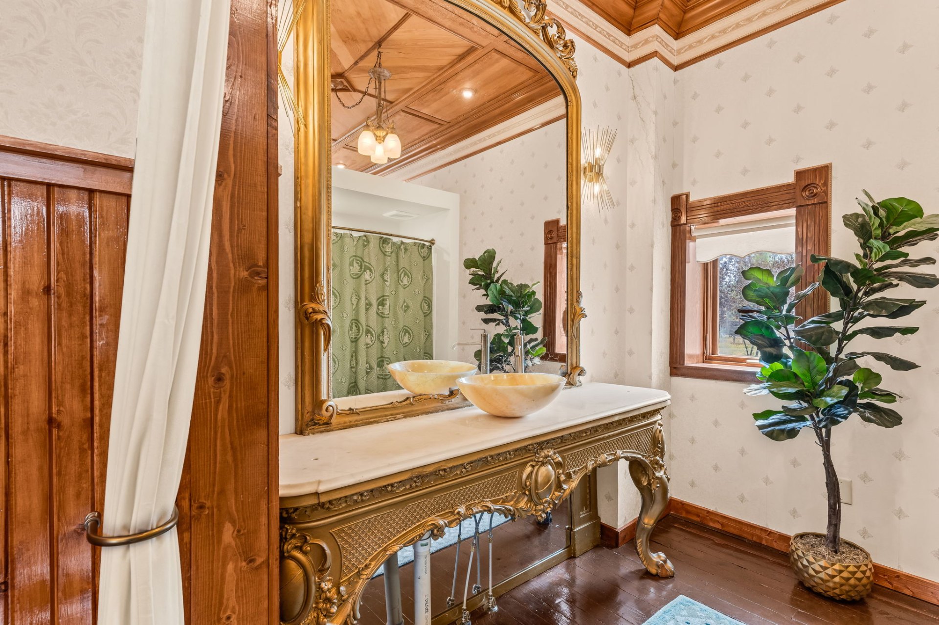 Ornate gilt vanity with onyx basins